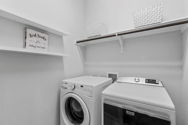 clothes washing area with laundry area and separate washer and dryer