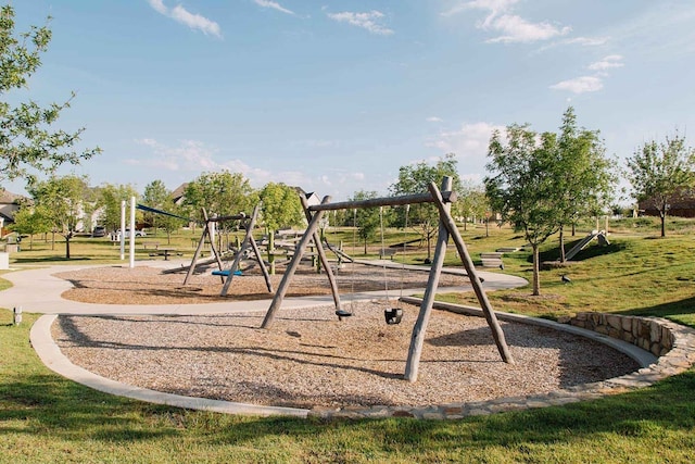 community jungle gym featuring a yard