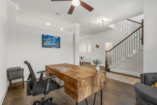 home office with a ceiling fan, wood finished floors, visible vents, and baseboards