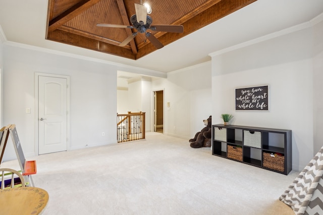 interior space featuring carpet floors, a tray ceiling, wood ceiling, and crown molding