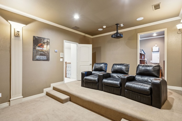 carpeted home theater room with baseboards, visible vents, crown molding, and recessed lighting