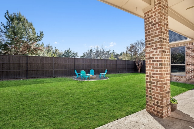 view of yard with an outdoor fire pit and a fenced backyard