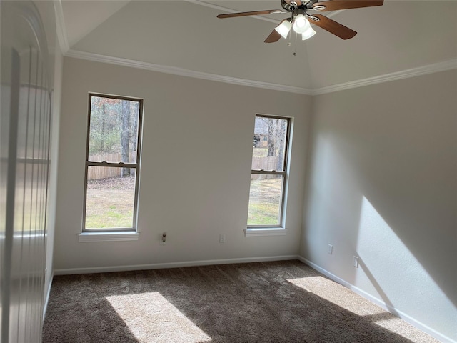 unfurnished room featuring vaulted ceiling, carpet floors, ornamental molding, and plenty of natural light