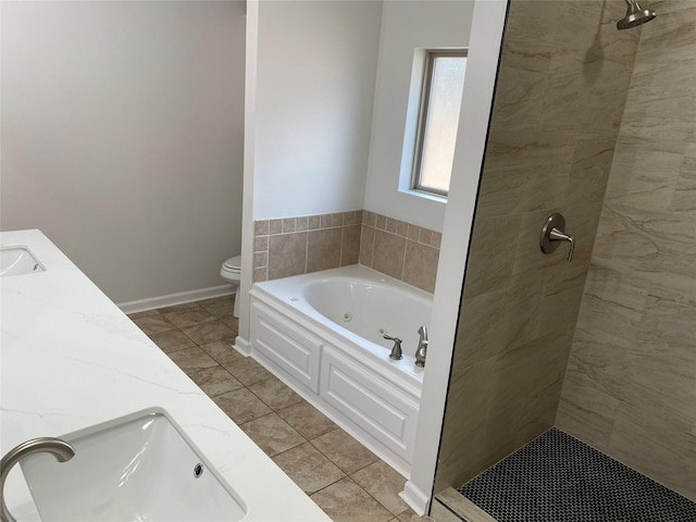 full bathroom with toilet, a sink, tiled shower, a jetted tub, and double vanity