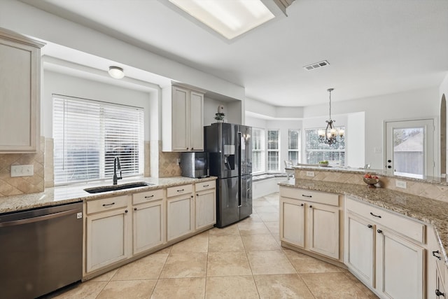 kitchen with light tile patterned floors, visible vents, dishwasher, black fridge with ice dispenser, and a sink