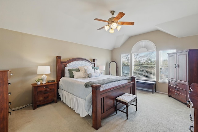 bedroom featuring lofted ceiling, light colored carpet, and ceiling fan