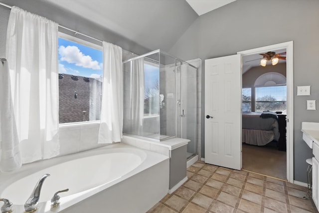 ensuite bathroom with a garden tub, vaulted ceiling, a shower stall, and ensuite bathroom