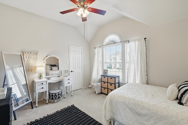 bedroom with a ceiling fan, lofted ceiling, multiple windows, and carpet flooring