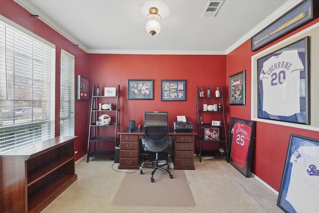 carpeted office space featuring baseboards, visible vents, and crown molding