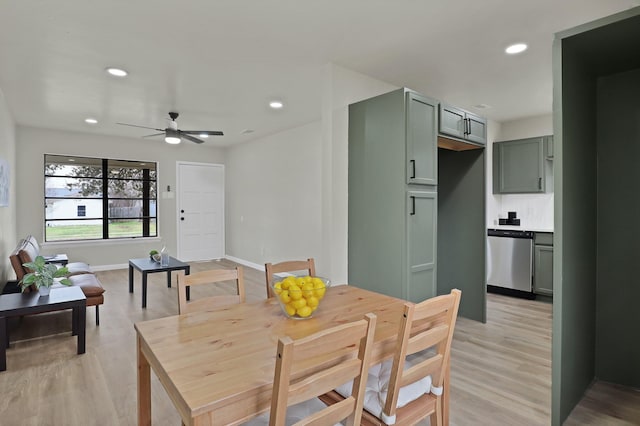 dining area featuring baseboards, light wood finished floors, a ceiling fan, and recessed lighting