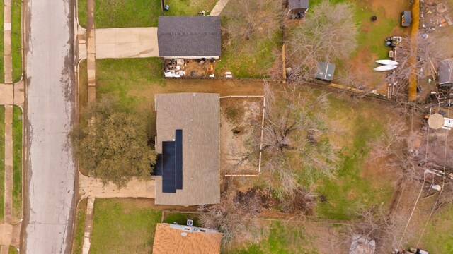 rear view of house featuring fence and a lawn