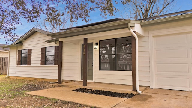 property entrance with an attached garage