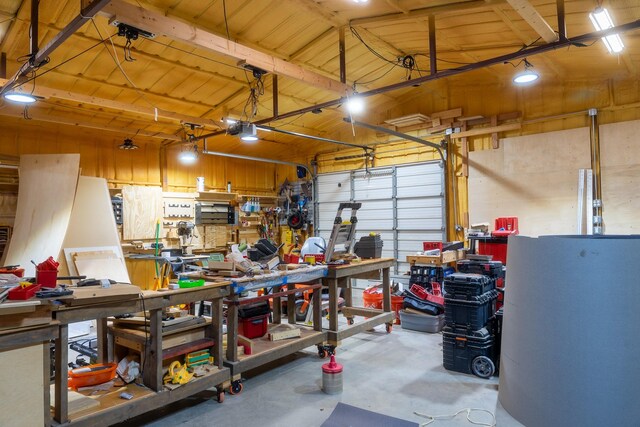 garage featuring a garage door opener and a workshop area