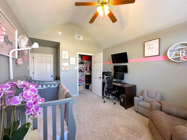 carpeted bedroom with lofted ceiling, a closet, visible vents, and ceiling fan