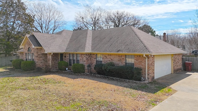 view of front of house featuring a garage, brick siding, fence, and a chimney