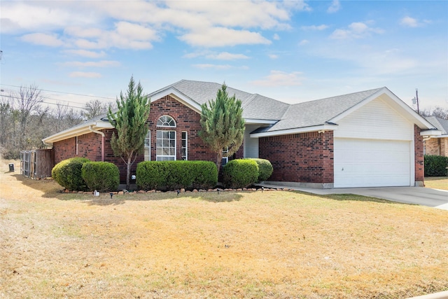 view of front of house with brick siding, a shingled roof, concrete driveway, a front yard, and a garage