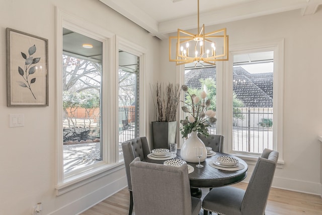 dining space featuring plenty of natural light and wood finished floors