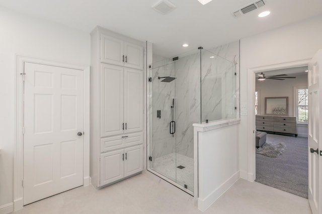 bathroom with recessed lighting, a marble finish shower, visible vents, and baseboards