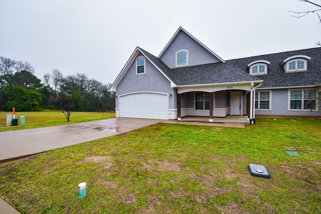 view of front of home with concrete driveway, roof with shingles, a front yard, and stucco siding