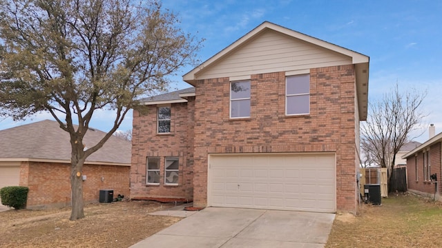 traditional-style home with a garage, concrete driveway, brick siding, and central AC unit