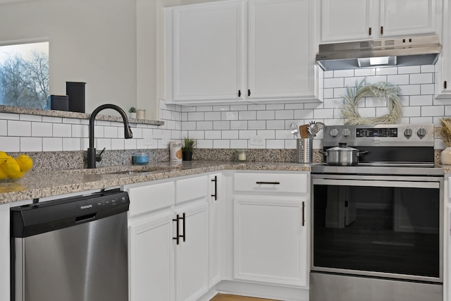 kitchen with white cabinets, a sink, stainless steel appliances, under cabinet range hood, and backsplash