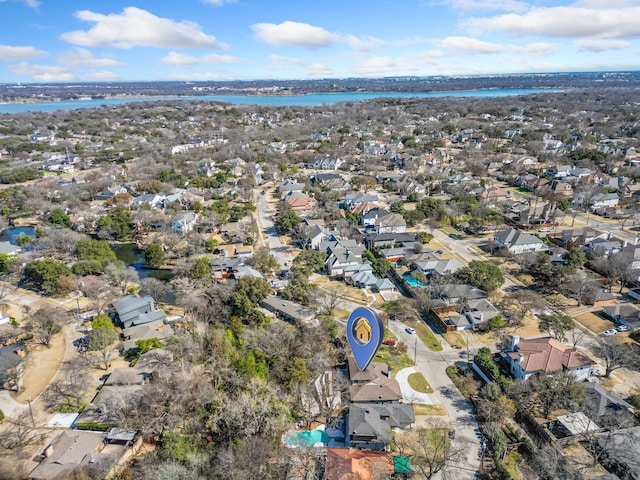 drone / aerial view featuring a residential view and a water view