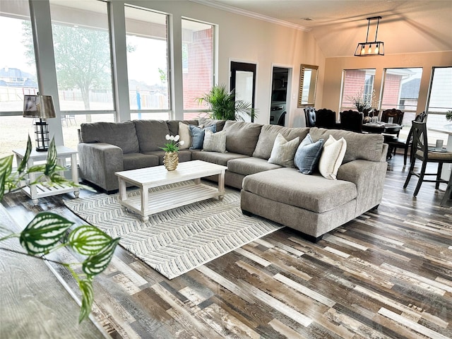 living area with crown molding and wood finished floors