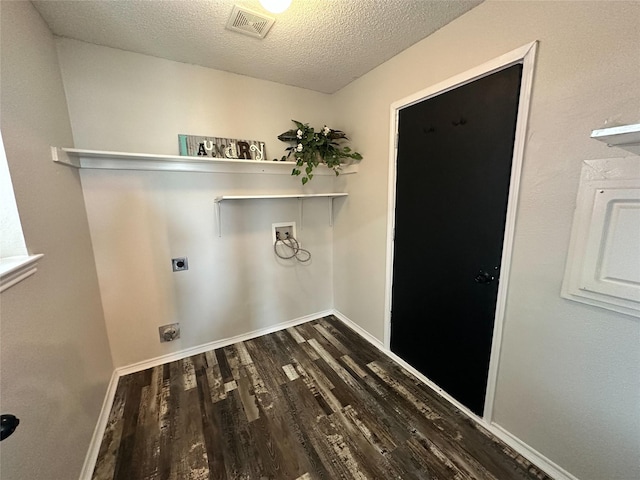 laundry room featuring hookup for an electric dryer, laundry area, dark wood-style flooring, washer hookup, and visible vents