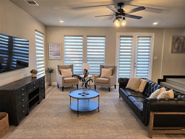 living area featuring recessed lighting, a healthy amount of sunlight, and visible vents