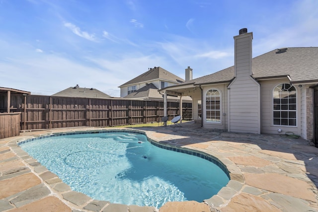 view of pool featuring a patio, fence, and a fenced in pool