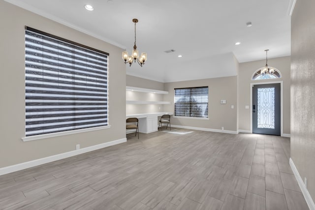 foyer entrance with baseboards, light wood-style floors, recessed lighting, and an inviting chandelier