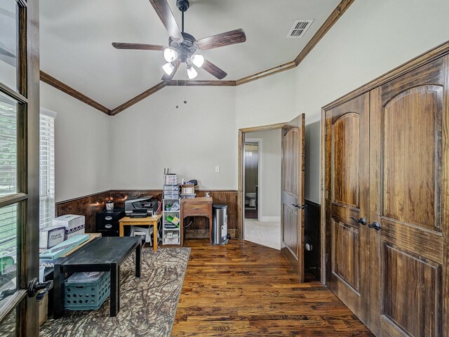 office space featuring ornamental molding, a wainscoted wall, visible vents, and dark wood-type flooring