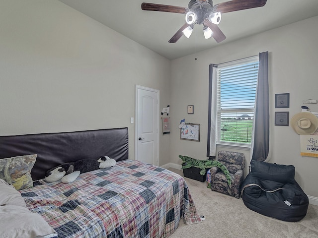 bedroom with carpet floors, ceiling fan, and baseboards