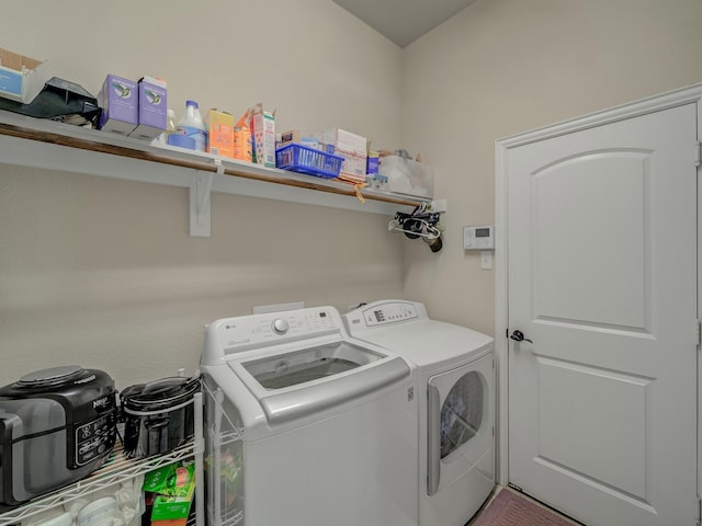 washroom featuring laundry area and independent washer and dryer