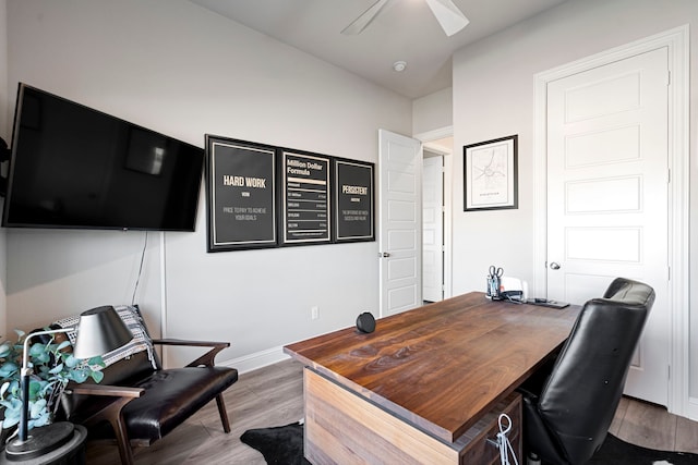 office area with ceiling fan, baseboards, and wood finished floors