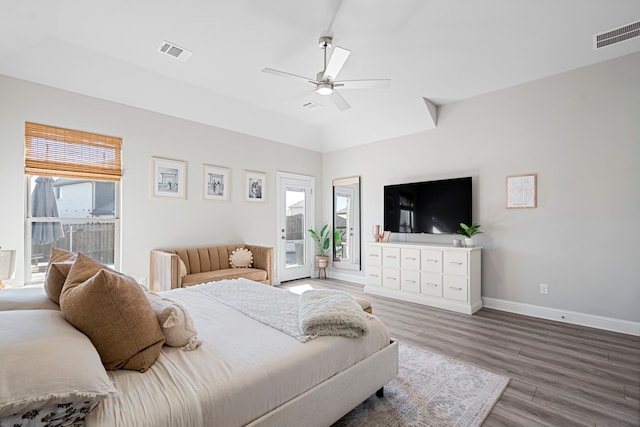 bedroom featuring access to outside, visible vents, and multiple windows