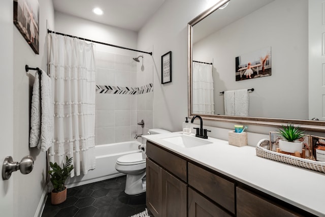 bathroom with shower / tub combo with curtain, vanity, toilet, and tile patterned floors