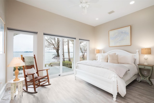 bedroom featuring access to outside, recessed lighting, visible vents, and light wood-style floors