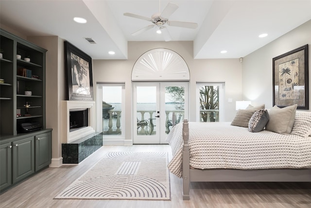 bedroom with french doors, light wood finished floors, visible vents, and recessed lighting