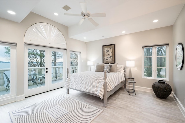 bedroom featuring light wood-type flooring, access to exterior, multiple windows, and visible vents