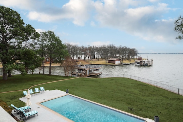 view of pool featuring a yard, a dock, a water view, and fence