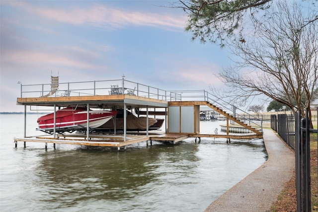 view of dock with a water view and boat lift