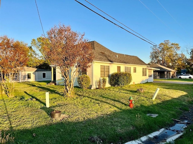 back of house with a yard