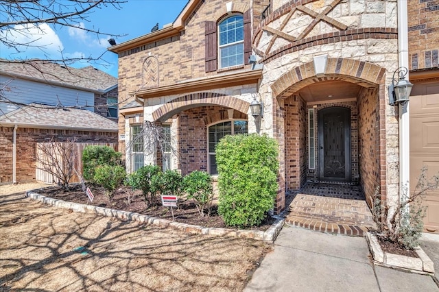 property entrance with brick siding