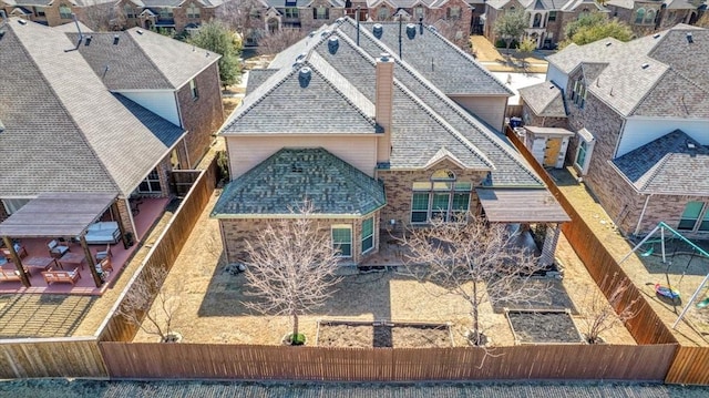 birds eye view of property with a residential view