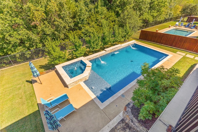 view of pool featuring a lawn, a fenced backyard, and a fenced in pool