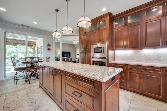 kitchen with stainless steel appliances, visible vents, hanging light fixtures, backsplash, and ornamental molding