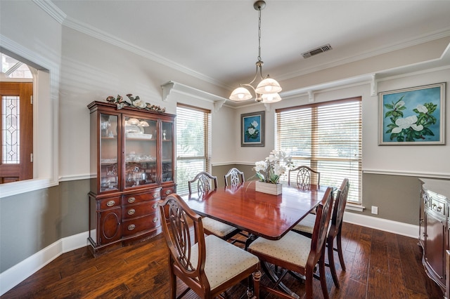 dining space with plenty of natural light, crown molding, visible vents, and dark wood-type flooring