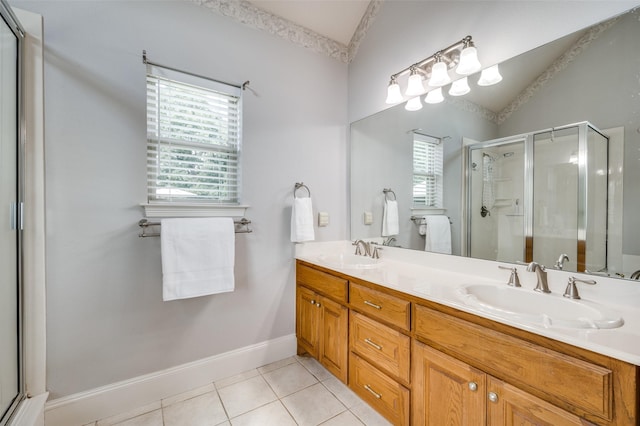 bathroom featuring plenty of natural light, a sink, and tile patterned floors