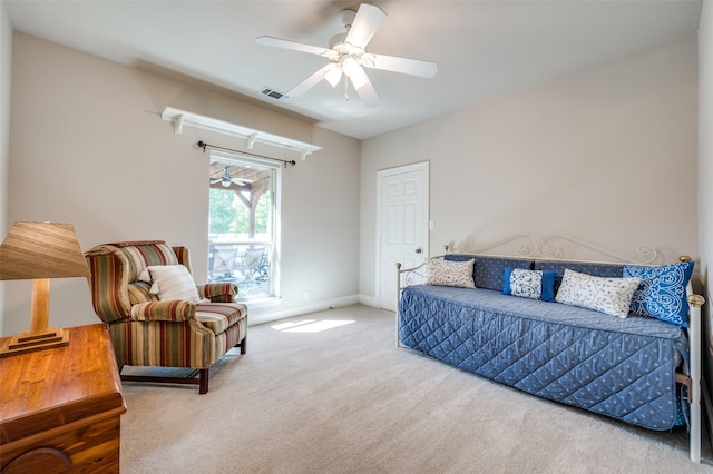 bedroom featuring carpet floors, baseboards, visible vents, and a ceiling fan